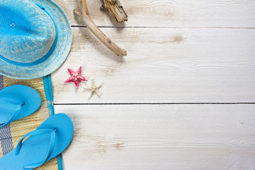 beach accessories on white wooden boards
