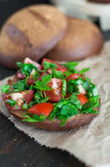 Italian tomato bruschetta with chopped vegetables, herbs and oil