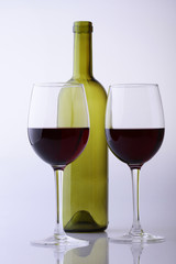 Empty bottle and glasses with wine