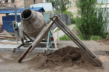 Old cement mixer.
Industrial cement mixer machine at construction site.