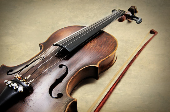 Classic violin on grunge paper texture.