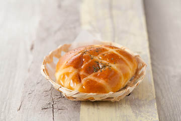 Freshly baked homemade bread in a bamboo basket, Selective focus