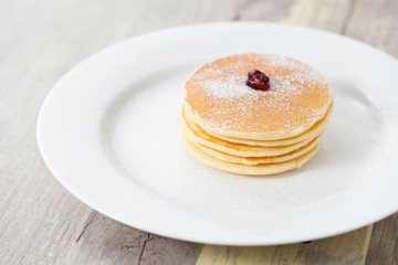 Homemade pancakes on old wood table