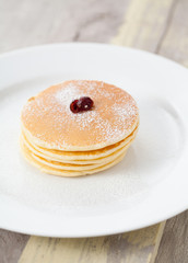 Homemade pancakes on old wood table
