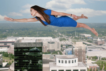Fototapeta na wymiar Floating flying woman