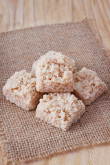 Coconut candy cocada on sackcloth