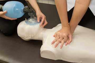 Paramedic practicing Cardiopulmonary resuscitation, CPR on a dummy