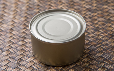 Short aluminum can over wicker background