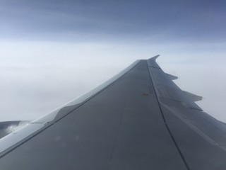 Fototapeta na wymiar wing of an airplane while inflight