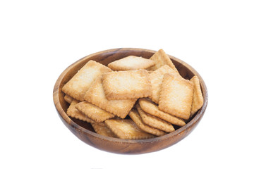 Mini coconut biscuit in wood plate isolated on white background