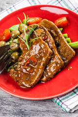 Pork chop with sauce and asparagus