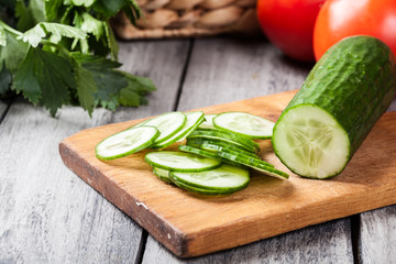 Chopped vegetables: cucumber on cutting board