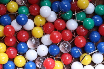 Background with multicolored  plastic mosaic pins
