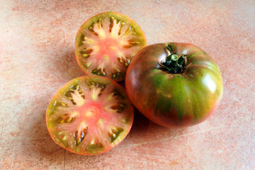 sliced cherokee purple tomato, an heirloom variety of tomatoes