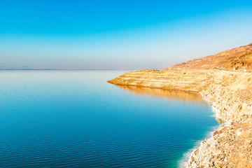 Dead Sea at Pillar of Lot's wife in Jordan, with Israel visible.