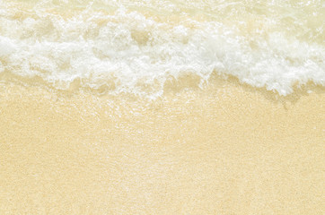 Fototapeta na wymiar White sand and waves splash
