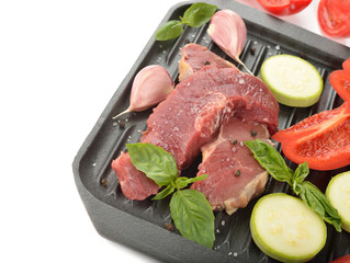 Raw steak and fresh vegetables