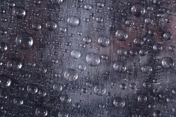 Water drops on the scratched surface