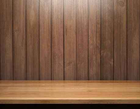 Empty shelf on wooden plank wall