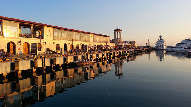 Sochi seaport shallow dock, water reflections