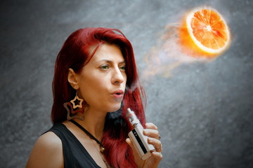 Elegant woman smoking e-cigarette tropical fruits taste 