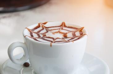 Hot coffee in white cup on counter coffee