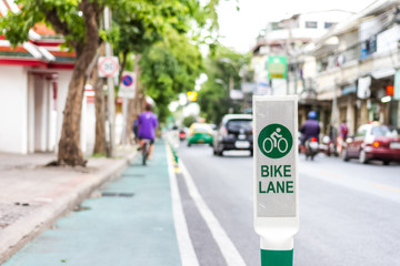 bike lane sign on road