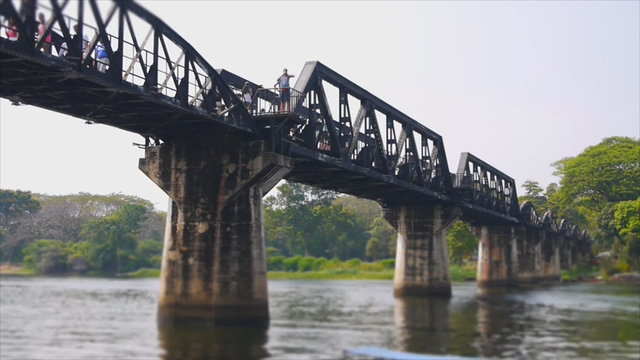 Speed video of Kwai river bridge with tourism and transportion by long tail boat