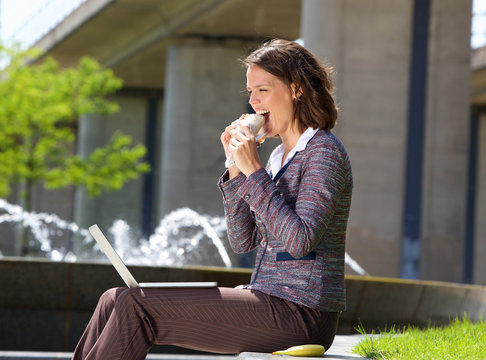 Business Woman Eating Food During Lunch Break