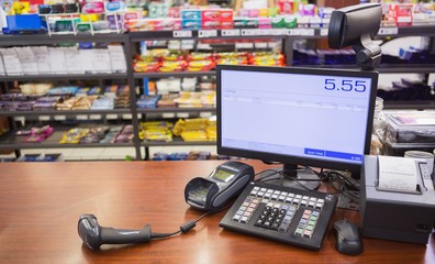 Cash register on wooden table - obrazy, fototapety, plakaty