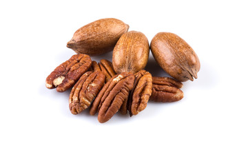 Few pecan nuts isolated on white