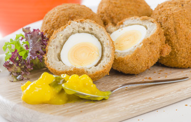 Scotch Egg - Hard-boiled egg wrapped in sausage meat, coated in breadcrumbs and deep-fried.