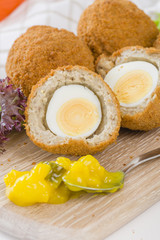 Scotch Egg - Hard-boiled egg wrapped in sausage meat, coated in breadcrumbs and deep-fried.