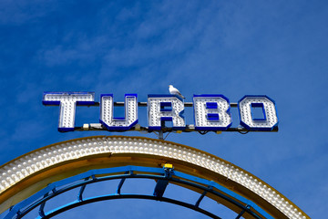 Amusement Park Rides On Brighton Pier. Roller coaster with sea gull.