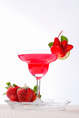 Strawberry cocktail with berry in glass isolated on white backgr
