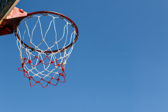 Basketball hoop with blue sky