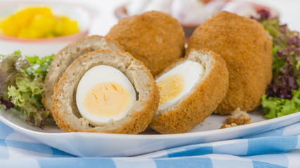 Scotch Egg - Hard-boiled egg wrapped in sausage meat, coated in breadcrumbs and deep-fried.