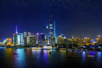 illuminated skyline and cityscape of shanghai