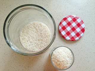 White rice in an open large glass jar