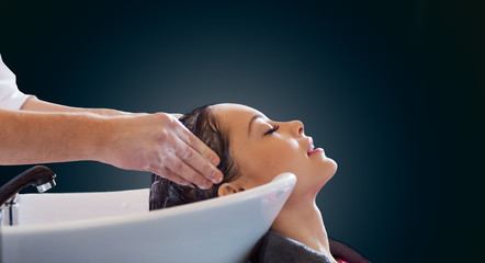 happy young woman at hair salon