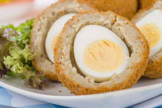 Scotch Egg - Hard-boiled egg wrapped in sausage meat, coated in breadcrumbs and deep-fried.