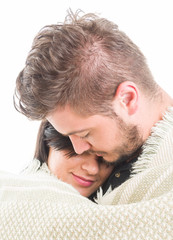 Fototapeta premium Couple in love covered with a blanket