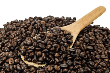 Coffee beans in an old wooden scoop