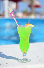 Full coctail glass by the pool
