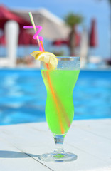 Full coctail glass by the pool
