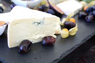 set of ingredients: cheese, olives, berries, sauces, snacks