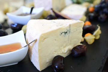 set of ingredients: cheese, olives, berries, sauces, snacks