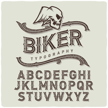 Biker style dirty letters alphabet with wings skull emblem. Light Background.