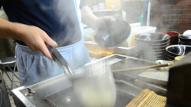 Cooking Udon noodles at Osaka, Japan