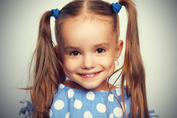 happy face funny child girl in blue
